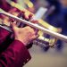 trumpeter plays his trumpet in the brass band during live event